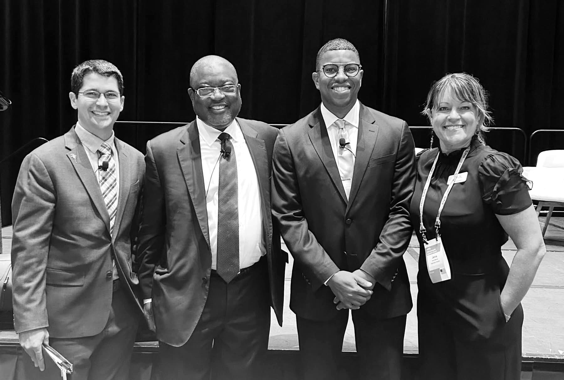 Takkeem Morgan on stage with Dr. William Bell of Casey Family Programs and Dr. Bart Klika of Prevent Child Abuse America at the NCSL 2023 Legislative Summit in Indianapolis