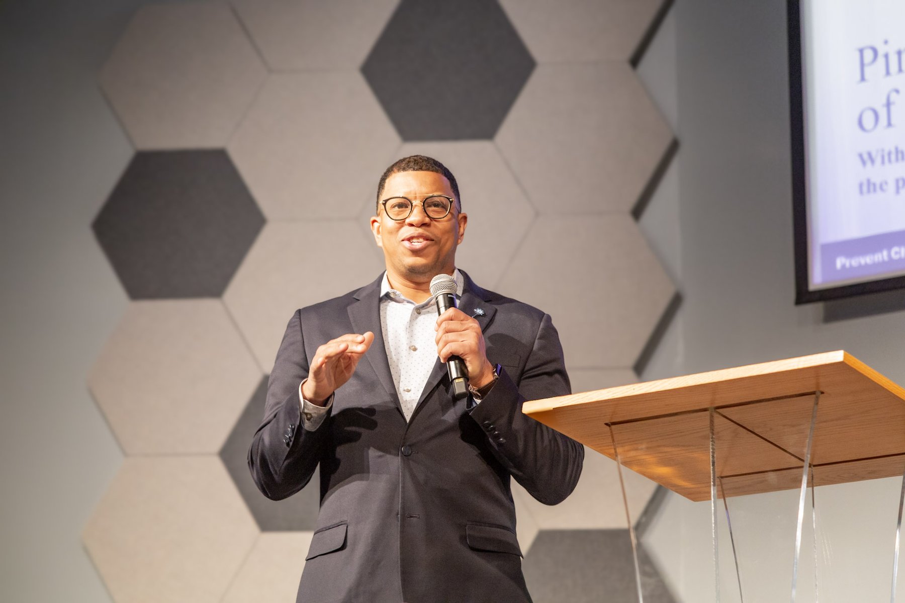 Close-up of Takkeem Morgan mid-sentence at the Pinwheels of Possibility keynote